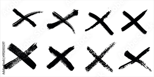 A collection of eight black x marks with varying brush strokes on a white background