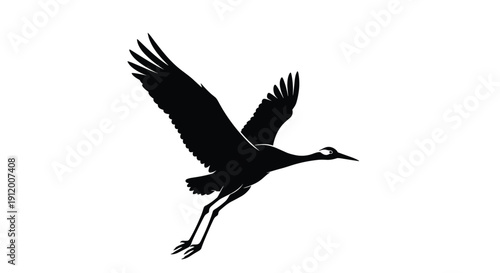 Graceful black silhouette of a Japanese crane or heron taking off into flight, with its long legs dangling as it rises.
