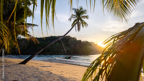 Quadro su tela Sunset at Khlong Hin Beach in Koh Kood, Thailand with swaying palm trees and tra