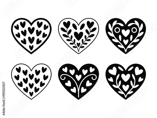 A collection of six black and white heart designs with various patterns and shapes on a plain background
