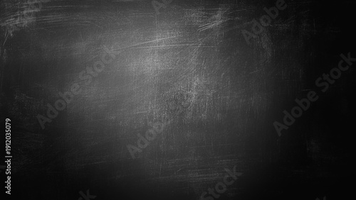 Abstract texture of chalk rubbed out on blackboard or chalkboard background. School education, dark wall backdrop or learning concept.
