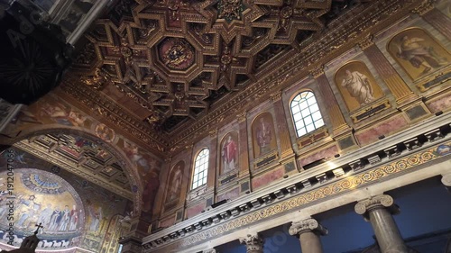 Slow motion looking up at golden ceiling in Santa Maria in Trastevere