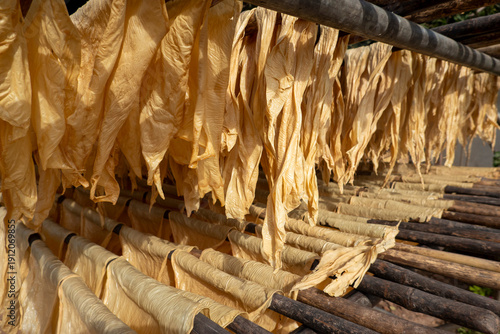 Tofu skin drying on a rack on Silk Island in Phnom Penh, Cambodia.  