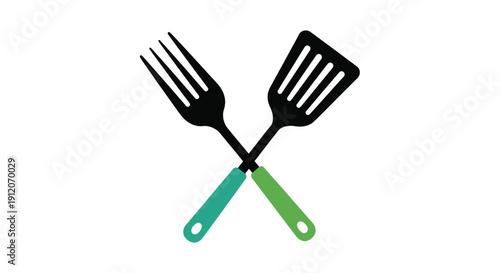 A crossed fork and spatula kitchen utensils for cooking and serving