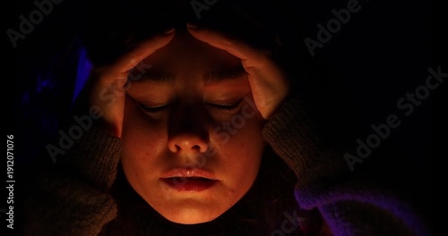 Unhappy sad teenage girl at night. Highly expressive.