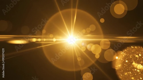 Golden orange lens flare with starburst on black background
