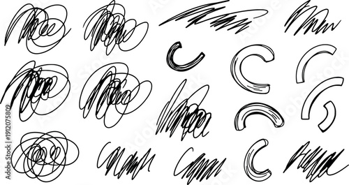 Collection of various black ink scribbles and swirls on white background