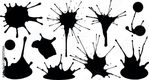 Ink blot silhouettes with dynamic splatters and drops on white background