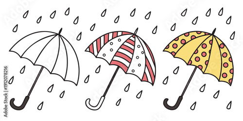 Three colorful umbrellas standing in the rain with raindrops falling around them.