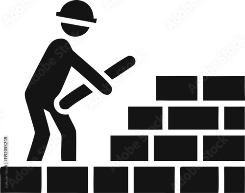 Construction worker wearing a hard hat carefully builds a brick wall with a trowel at a job site