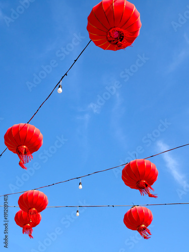 Red Chinese Lanterns Hanging Against Blue Sky for Lunar New Year Festival