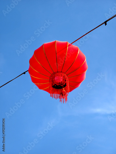 Red Chinese Lanterns Hanging Against Blue Sky for Lunar New Year Festival
