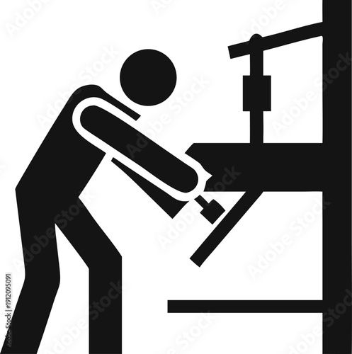Industrial worker operating heavy machinery, specifically a powerful press machine
