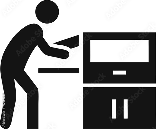 Male worker interacting with a desktop computer at his office workstation or desk