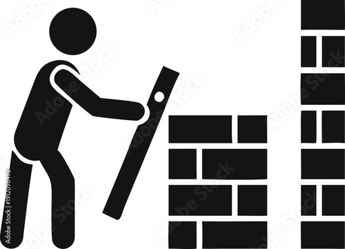 Skilled worker constructs a sturdy brick wall ensuring perfect alignment with a professional level tool