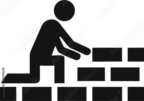 Worker kneeling to meticulously lay bricks for the foundation of a new wall