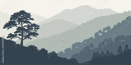 Majestic tree standing tall on a misty mountain peak overlooking a valley