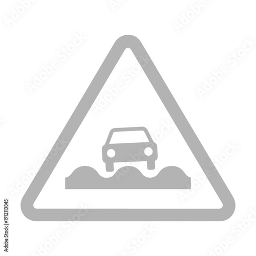 Warning sign indicating uneven or bumpy road surface ahead for vehicles, cautioning drivers of potential hazards and advising reduced speed for safety