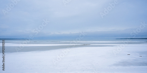 Photos Punakivi, snow covered beach along the frozen gulf of Finland in Winter, Estonia