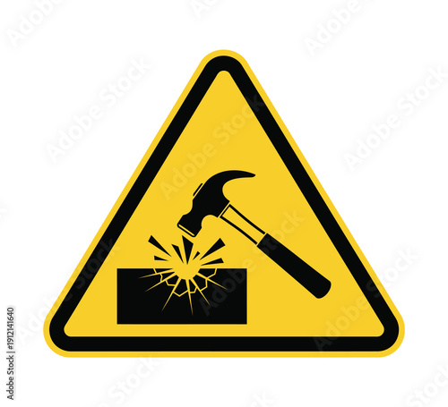 Yellow triangular warning sign with a black hammer striking a fragile surface, causing it to shatter, indicating a breakable material or impact hazard.