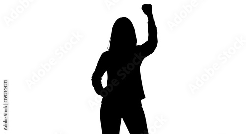woman in silhouette with one arm raised and fist clenched standing alone