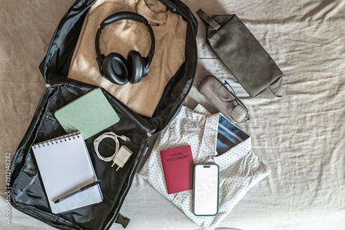 фотографія Modern travel flat lay with open backpack