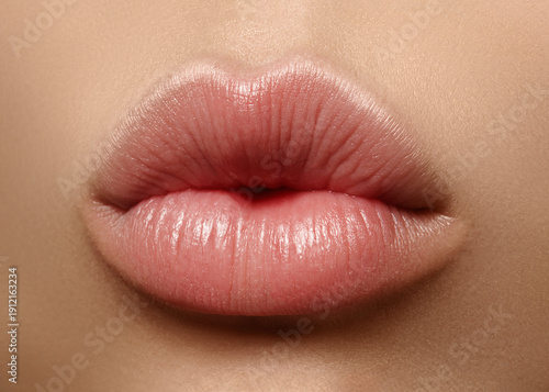 Close-up perfect natural lip makeup beautiful female mouth. Plump sexy full lips. Macro photo face detail. Perfect clean skin, fresh lip make-up. Beautiful spa tender lips. Valentines Day, Love Kiss