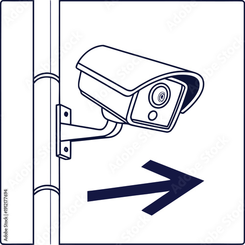 Security camera mounted on a wall with directional arrow