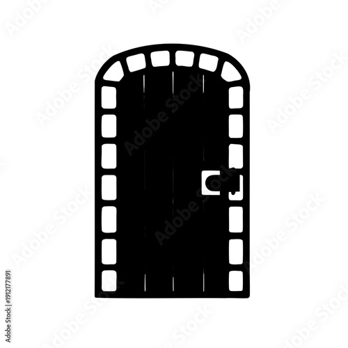 Silhouette of an ornate medieval arched door with patterned frame