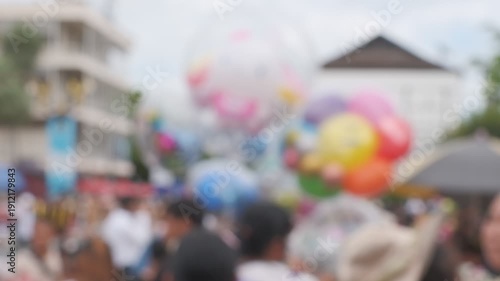Wallpaper Mural A crowd of people are gathered in a city street, with many of them holding balloons. The balloons are of various colors and sizes, and they are scattered throughout the scene. The atmosphere is lively Torontodigital.ca