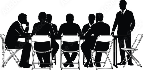 Corporate workshop silhouettes of a professional team sitting at a long table with a standing speaker for seminars and training.