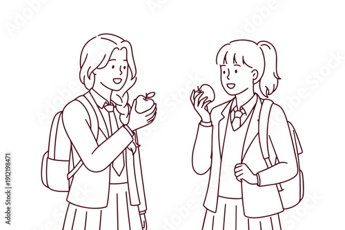 Two teenage friends standing together, chatting and eating fresh apples after school. Choosing healthy snacks to stay beautiful, energetic, and maintain a wellness routine.
