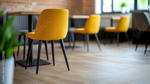Small green potted plant sitting on a light wooden table, bright diffused background. Creating a tranquil, atmosphere stylish