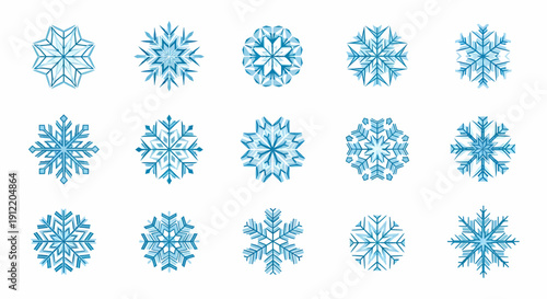 Collection of blue snowflakes arranged in a grid pattern on a clean surface viewed from directly above