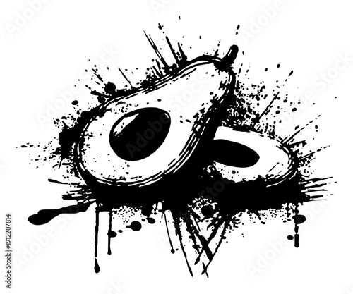 Sliced avocado fruit halves with creative black ink spatter and splash effects