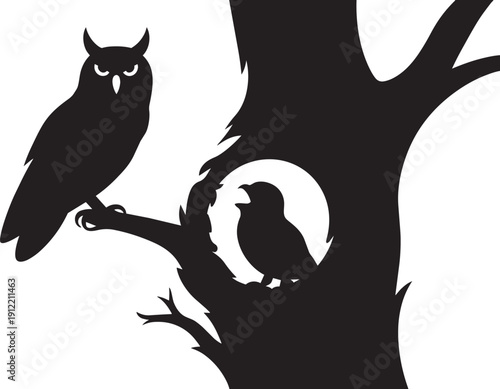 Silhouette of adult owl and chick on tree branches