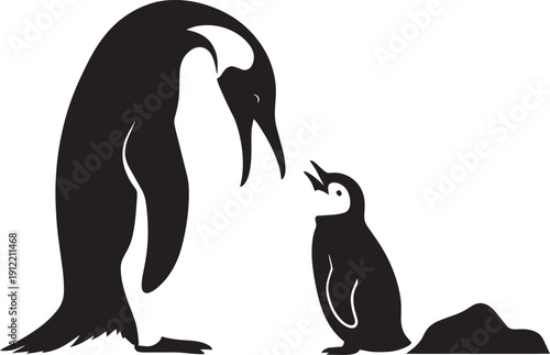 Silhouette of adult penguin with chick on icy ground