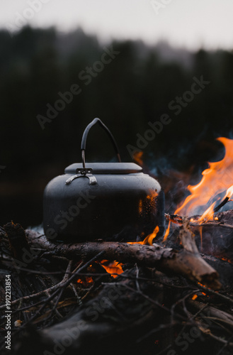 A coffee kettle on a camp fire