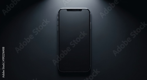 Modern smartphone mockup with dark blank screen, positioned vertically on a moody black background, highlighted by dramatic overhead lighting for product presentation.