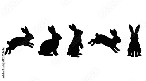 Five black rabbit silhouettes in various poses on white background