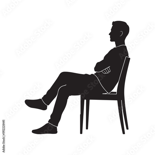 Silhouette of a man sitting on a chair in a relaxed position
