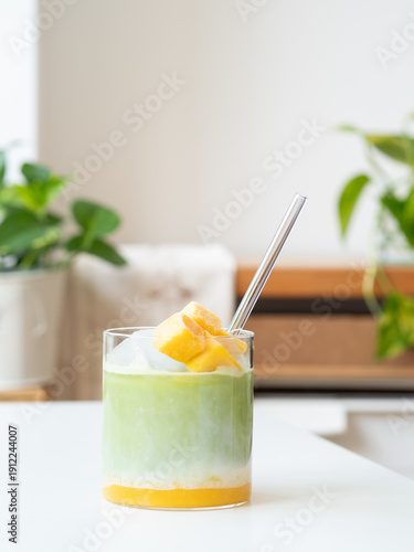 Refreshing iced matcha latte with mango chunks