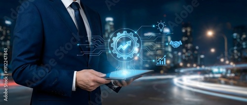 Wallpaper Mural Businessman holding tablet with futuristic automation, workflow integration, and digital transformation holographic interface. Torontodigital.ca