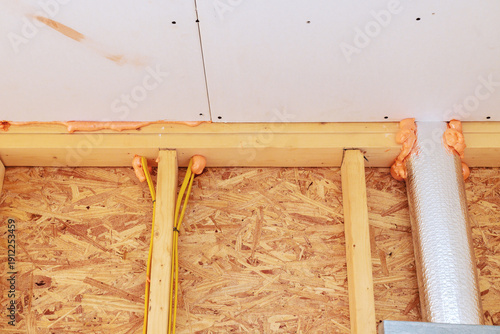 Obraz na plátně Construction work fire proof insulation wiring in building under renovation with