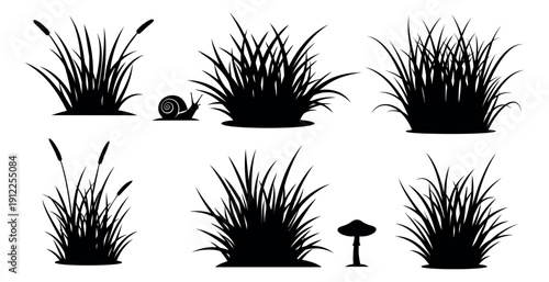 Simple silhouette nature elements set featuring various grass clumps, reeds, a snail, and a mushroom for nature-themed designs
