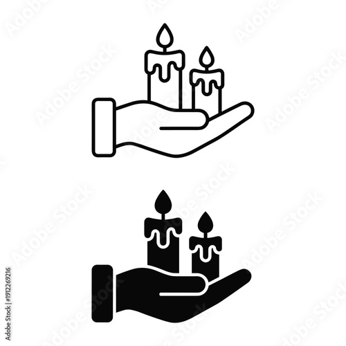 Human hand carrying two burning candles symbol for memorial or religious prayer