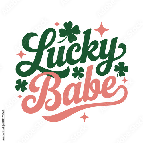 A colorful graphic design featuring the phrase Lucky Babe in green and pink letters with shamrocks and stars.