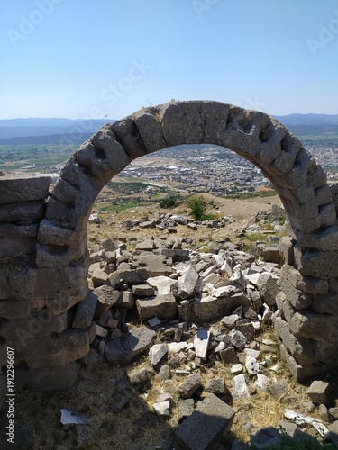 Remains of a stone arch structure standing among the ruins of Pergamon.
These architectural fragments illustrate the advanced engineering of the ancient city.
Pergamon was an important center of scien