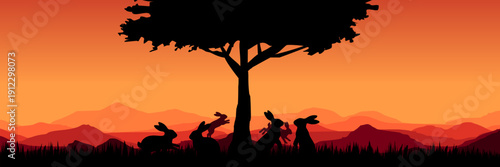 Serene outdoor scene with silhouette of bunnies under tree at dusk