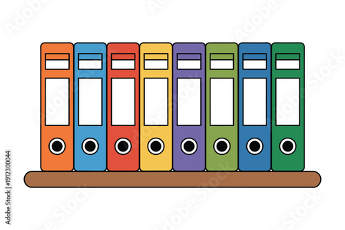 Row of colorful vertical ring binders sits neatly organized upon a wooden.